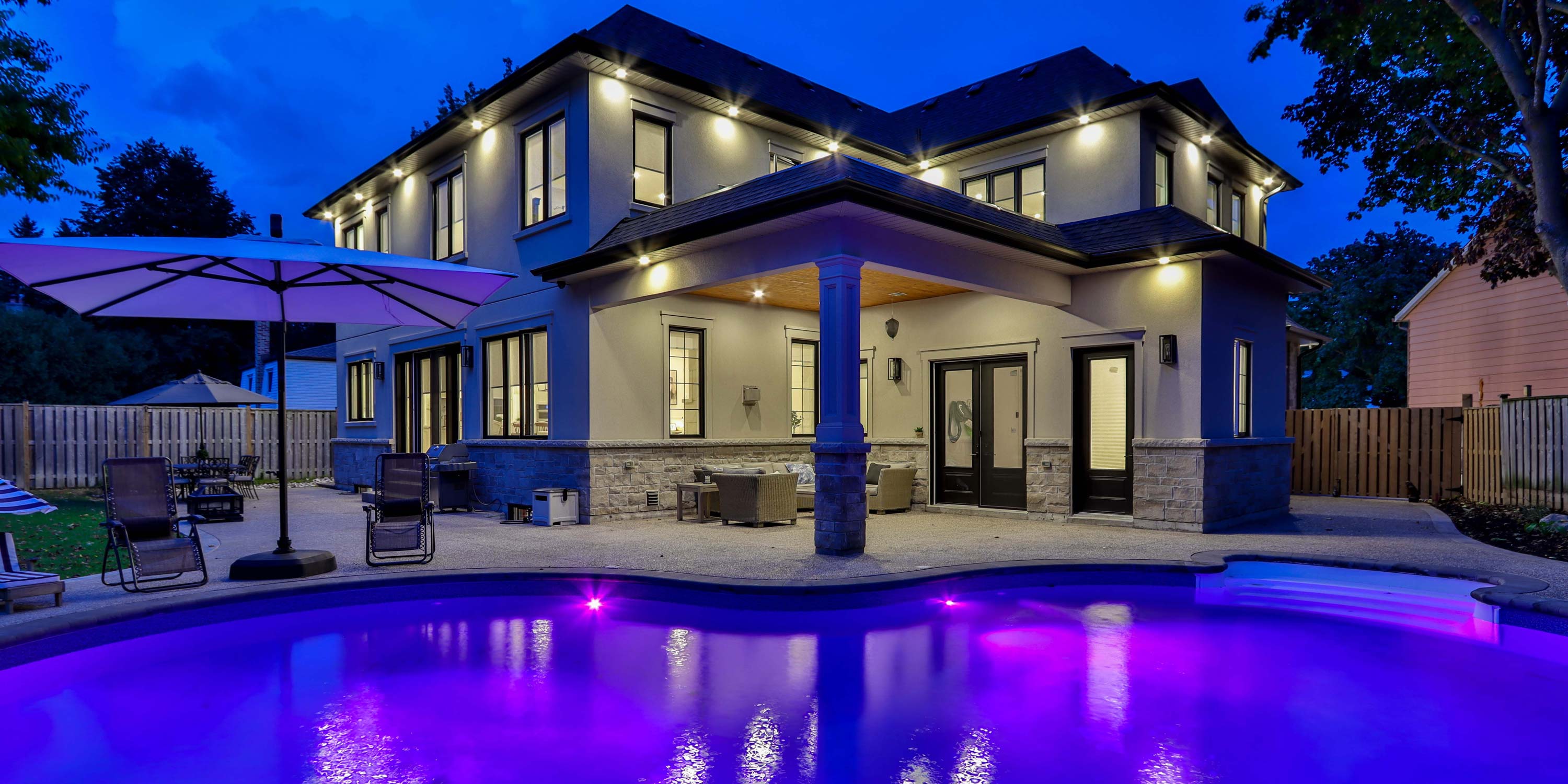 big screen displaying the av specialist logo on a home theater