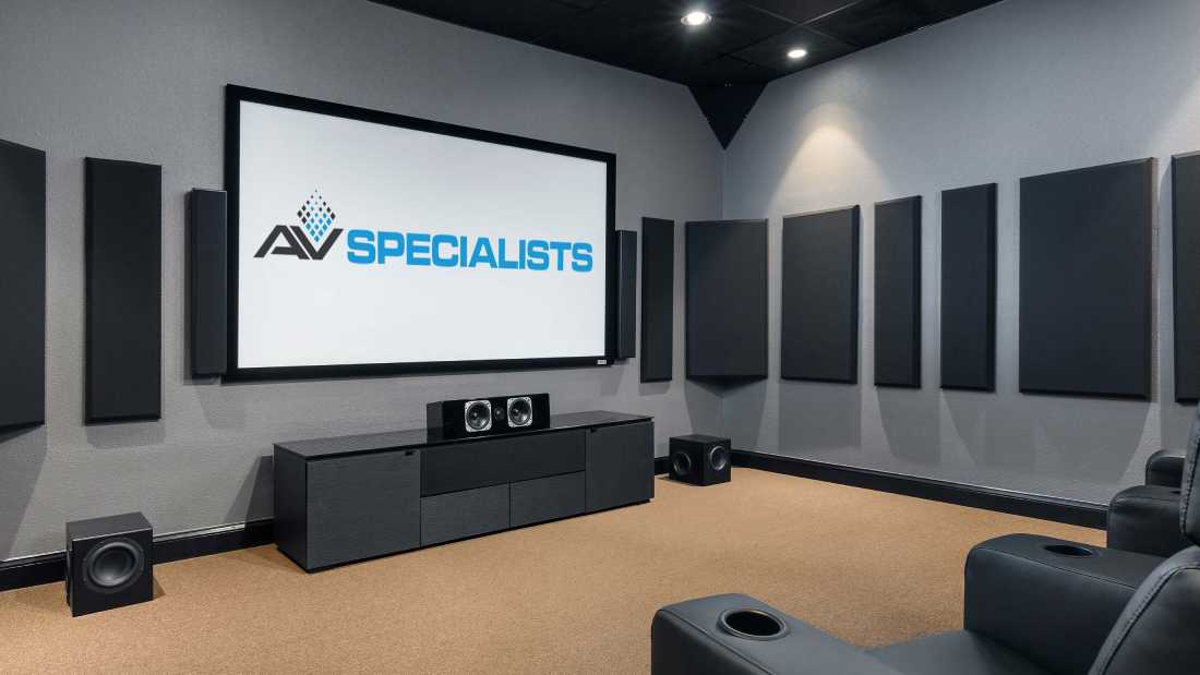 big screen displaying the av specialist logo on a home theater