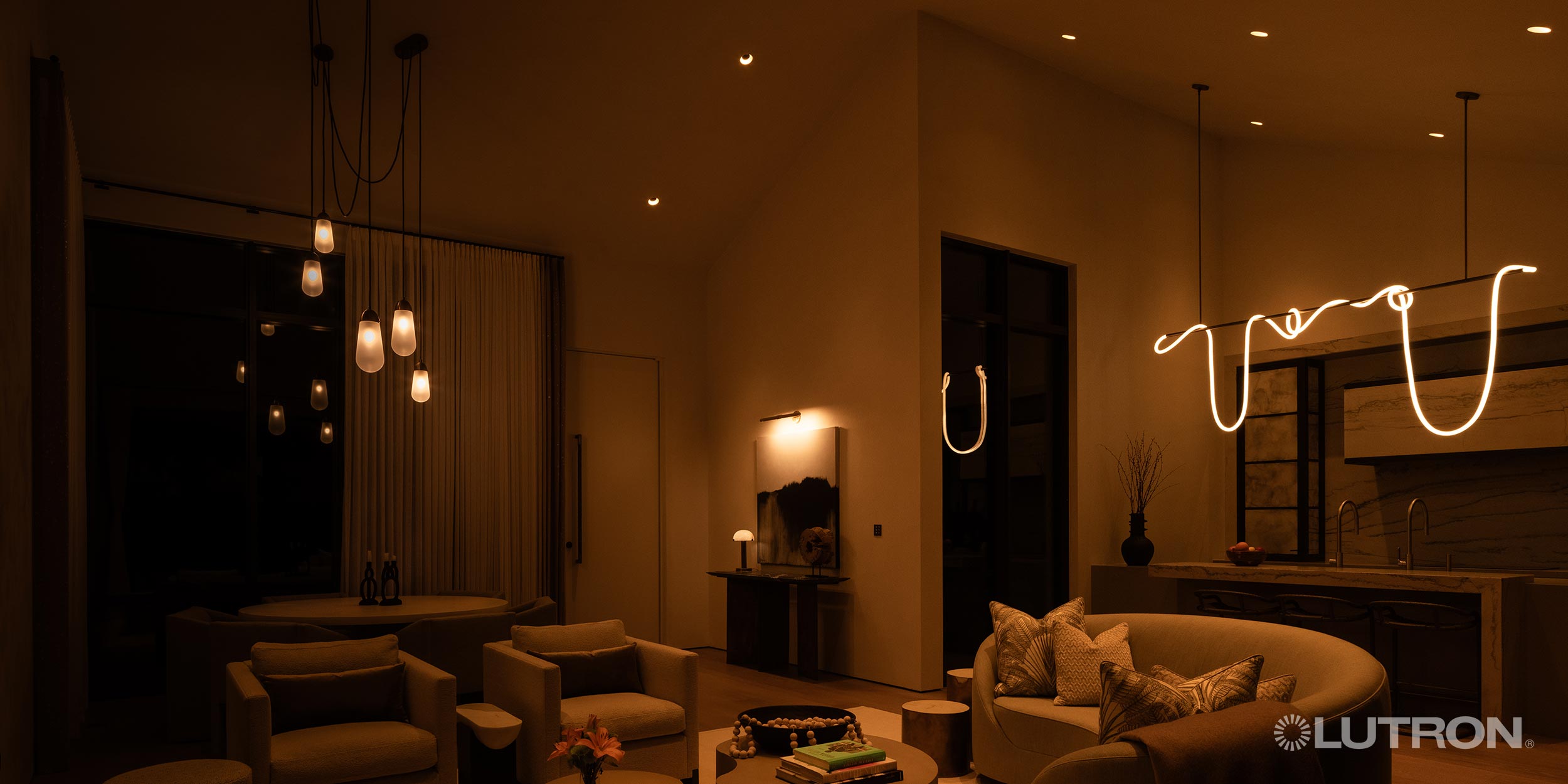 Cozy living room with designer lighting and Lutron branding