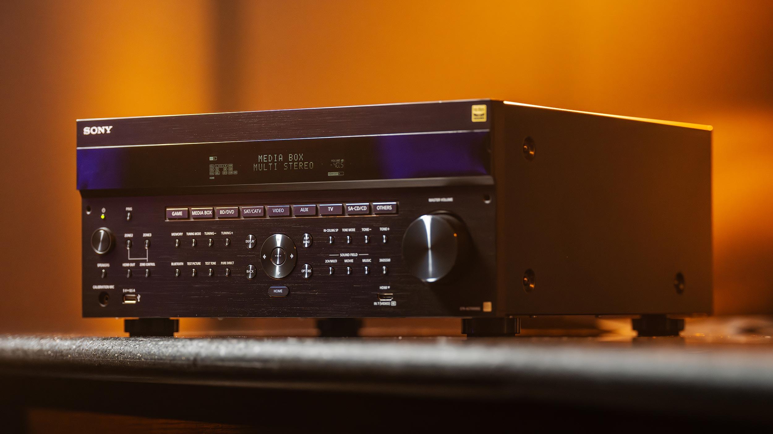 Audio receiver with detailed front panel and orange glow