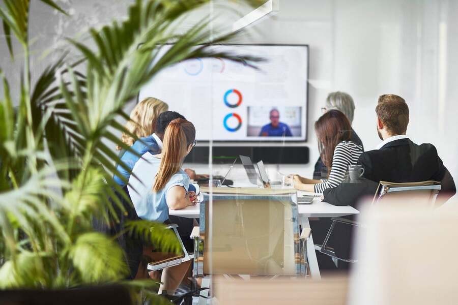 A team watching a presentation during a meeting.