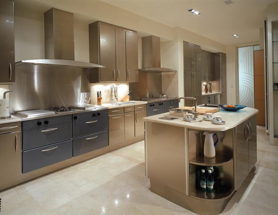 An illuminated kitchen space featuring lighting fixtures that are part of a residential lighting design and setup.