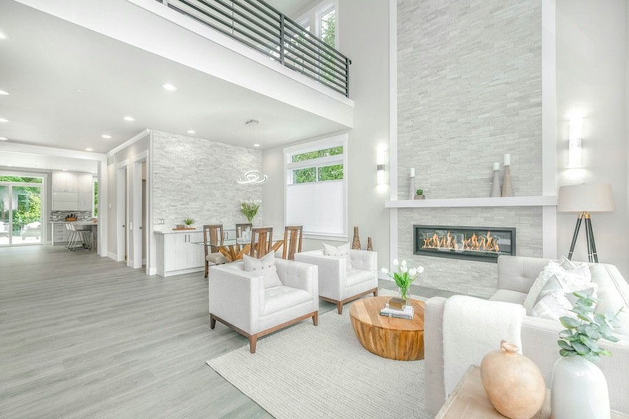 high-end living room with multiple windows and various lighting fixture styles.