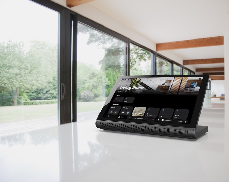 A bright living space with a Crestron smart home interface on a tabletop-mounted tablet.