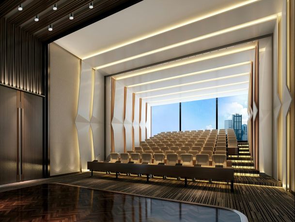 Modern auditorium with tiered seating and large window view