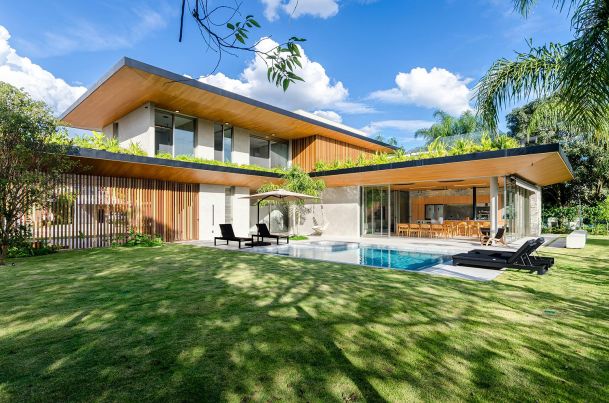 Casual restaurant interior with wooden tables and people dining