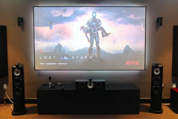 Home theater with projector screen displaying Netflix series Lost in Space