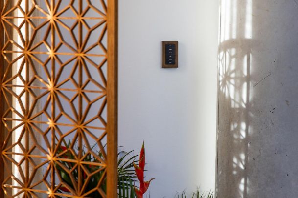 Luxury villa with pool, outdoor lounge chairs, and greenery