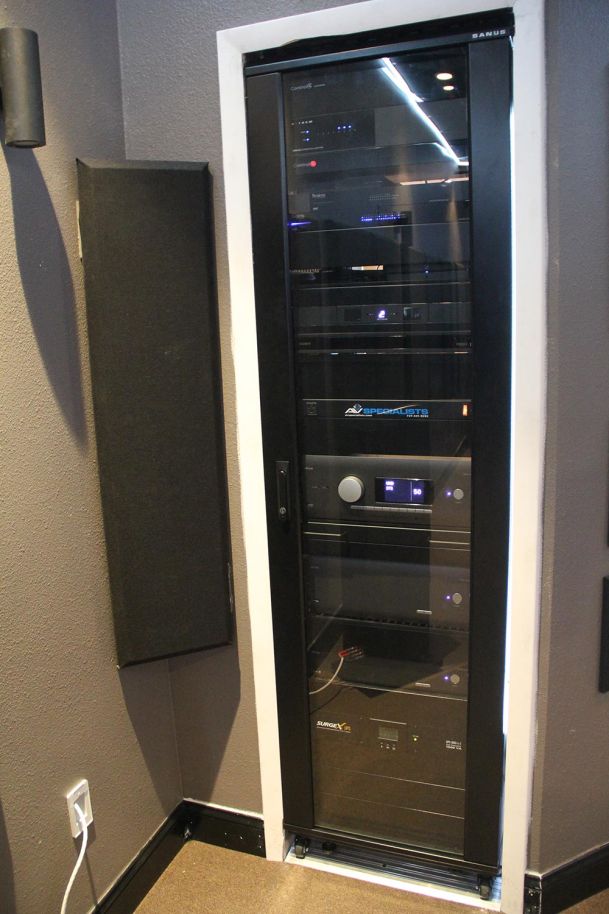 AV equipment rack with amplifiers and control systems